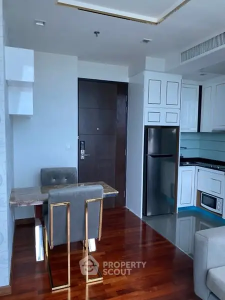 Modern apartment interior with sleek kitchen and dining area