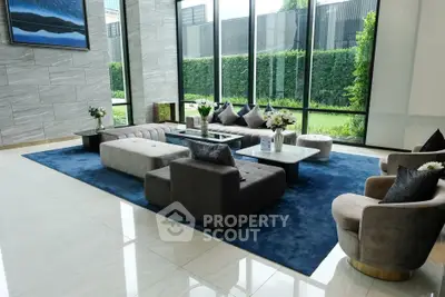 Luxurious modern living room with large windows and elegant furniture
