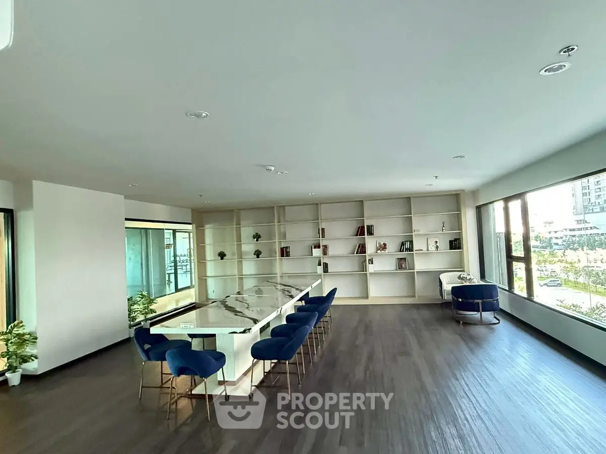 Spacious modern living room with elegant dining area and large windows