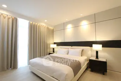 Luxurious modern bedroom with elegant lighting and stylish decor