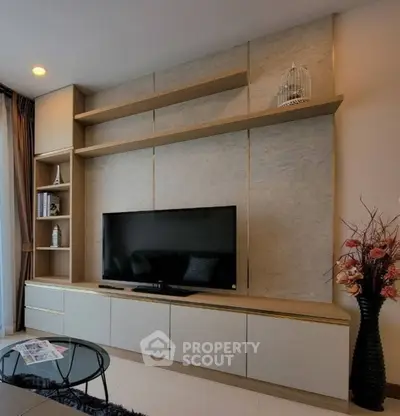 Modern living room with sleek TV unit and elegant decor