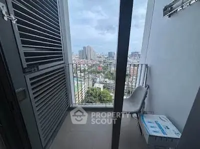 High-rise balcony with city view, perfect for urban living enthusiasts.