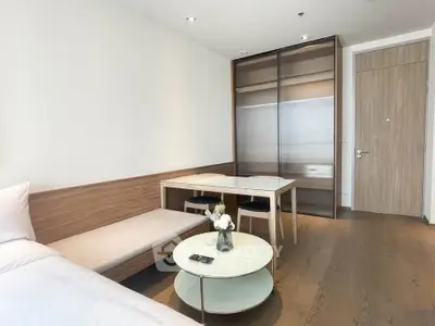 Modern minimalist bedroom with sleek furniture and wooden accents
