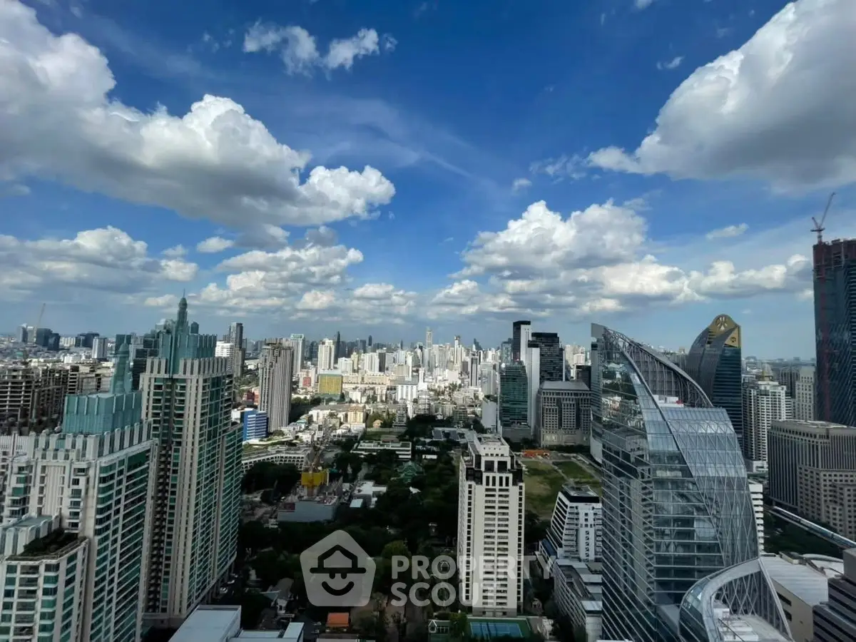 Stunning cityscape view from a high-rise building showcasing modern architecture and vibrant skyline.