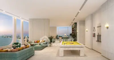 Luxurious living room with panoramic ocean view and elegant pool table, perfect for entertainment.