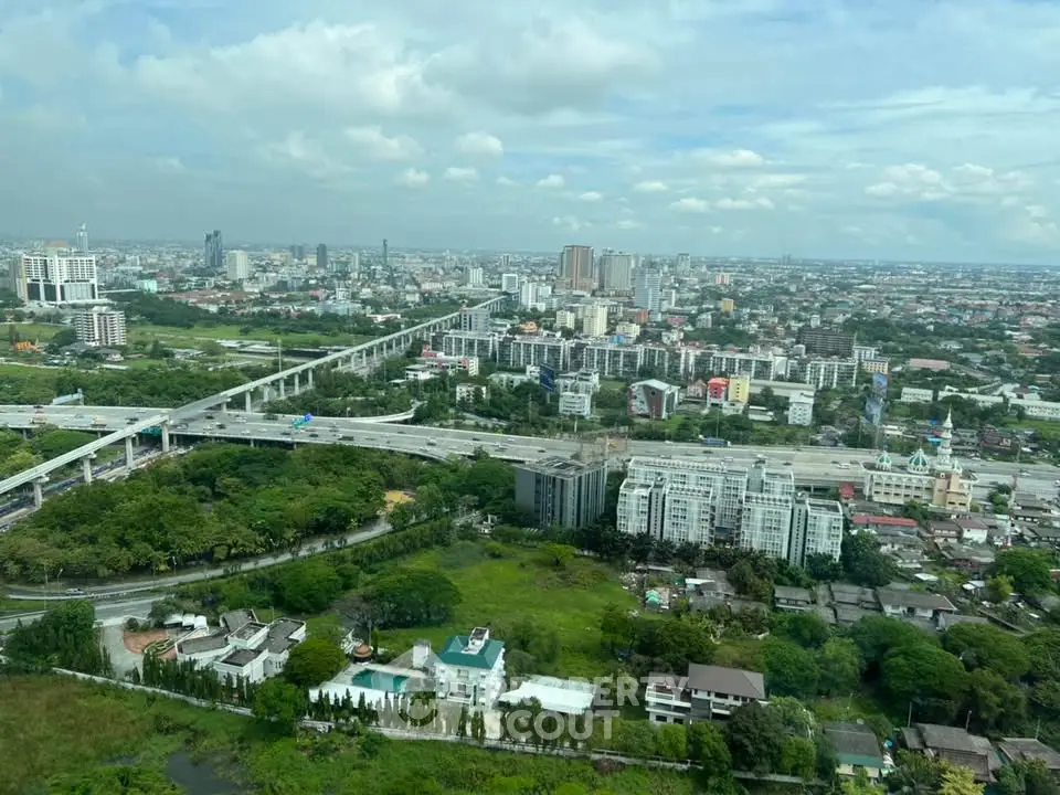 Stunning aerial view of urban landscape with lush greenery and modern infrastructure.