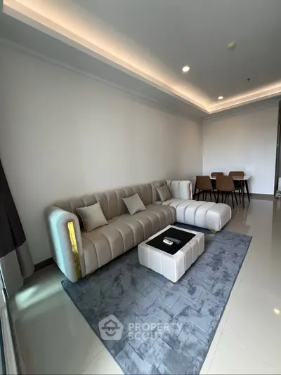 Modern living room with elegant sofa and dining area in a stylish apartment
