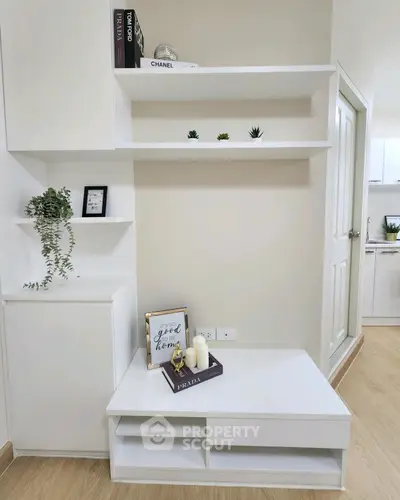 Modern minimalist living room with white shelves and decor