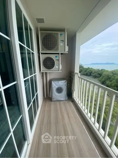 Stunning balcony view with lush greenery and distant mountains