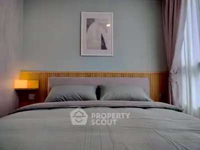 Cozy bedroom with modern decor and soft lighting, perfect for relaxation.