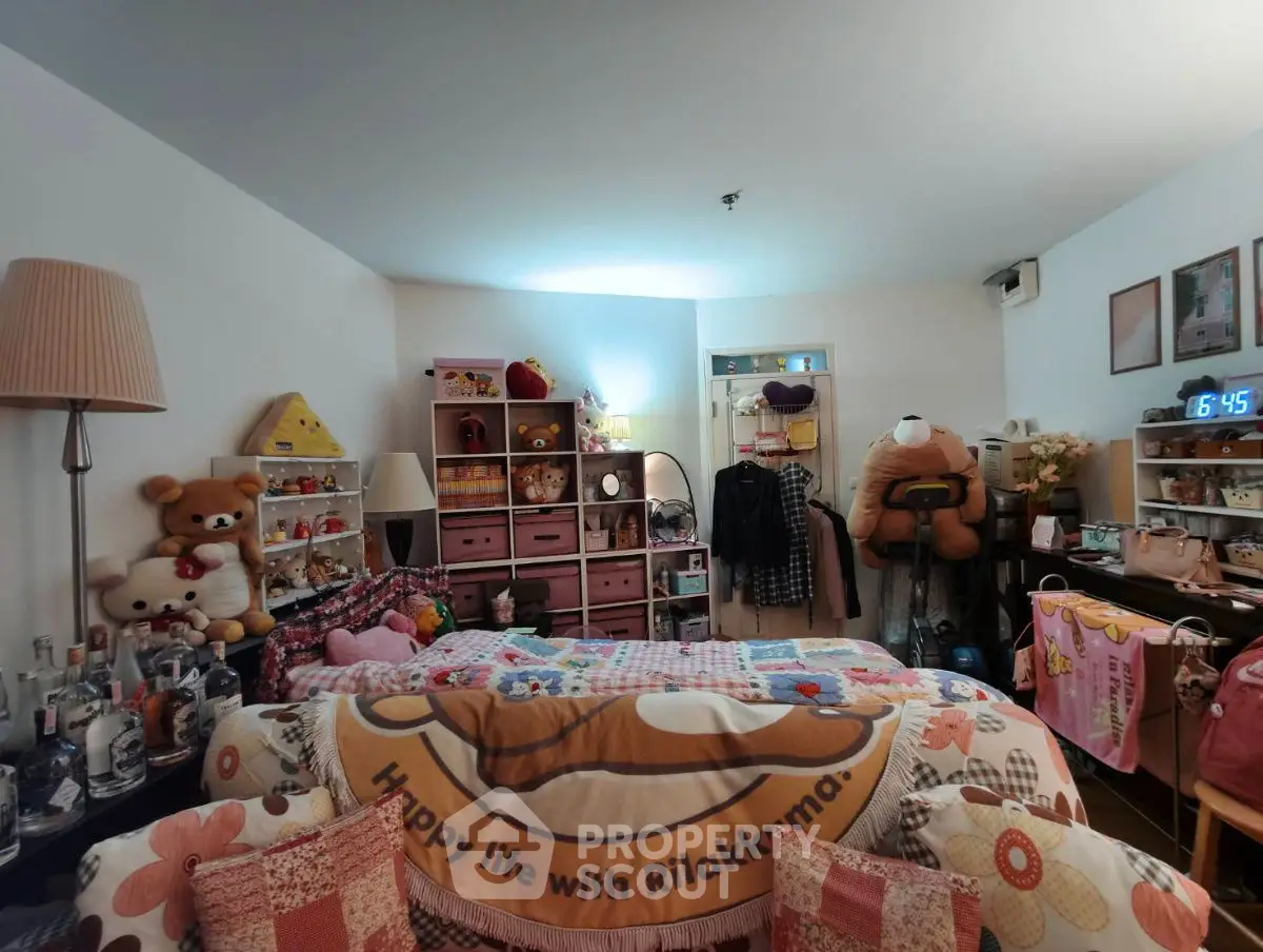 Cozy and playful bedroom with plush toys and colorful decor