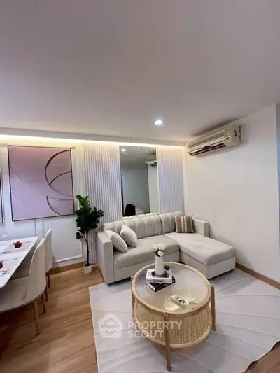 Modern living room with stylish decor and comfortable seating in a contemporary apartment.