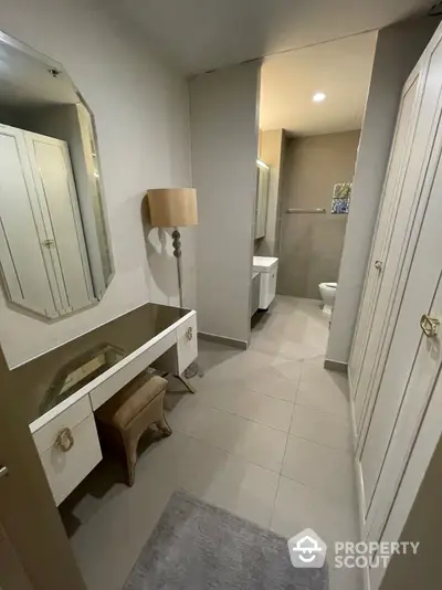 Elegant bathroom with modern fixtures, vanity area, and neutral color palette, perfect for a serene and stylish living experience.