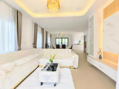 Luxurious living room with elegant chandelier and modern decor