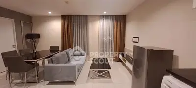Modern living room with sleek furniture and elegant decor in a contemporary apartment.