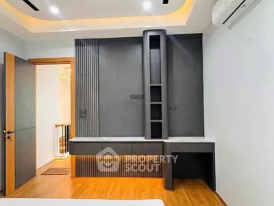 Modern bedroom with sleek built-in storage and ambient lighting