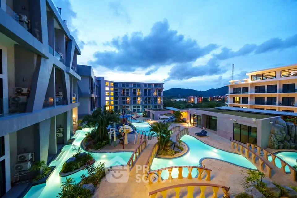 Luxurious resort-style apartment complex with stunning pool and scenic views at dusk.