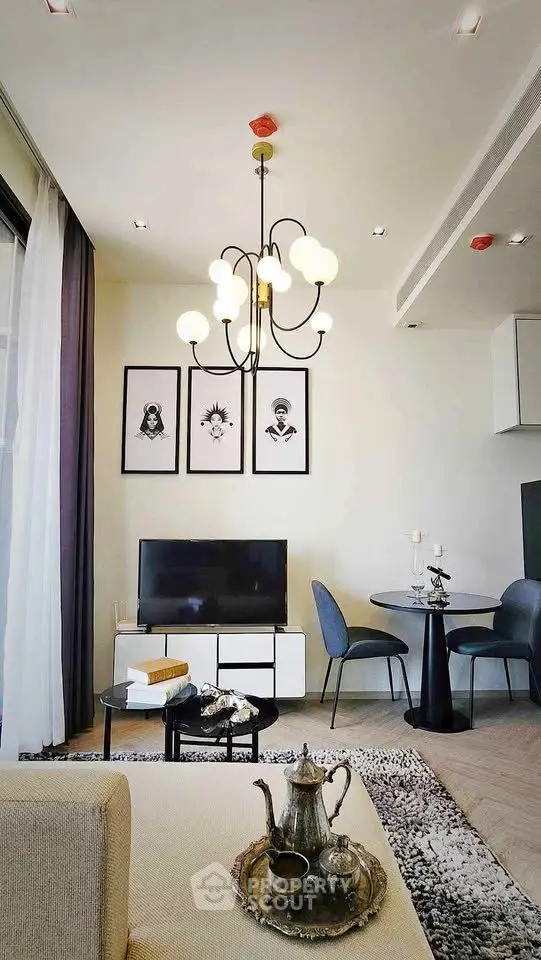 Modern living room with elegant chandelier and stylish decor
