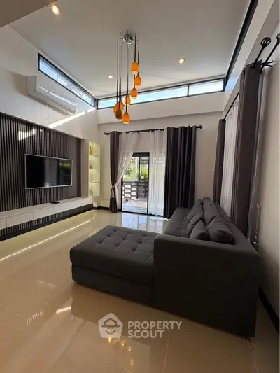 Spacious modern living room with stylish sofa and natural light