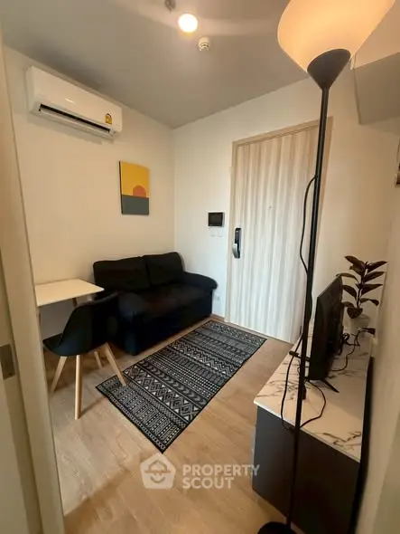 Cozy living room with modern decor and air conditioning