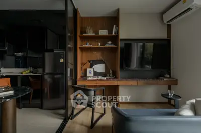 Modern living room with sleek design, featuring a built-in wooden desk, wall-mounted TV, and stylish furniture.
