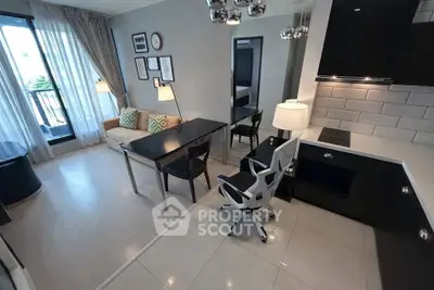 Modern open-layout living room with sleek kitchen and stylish decor