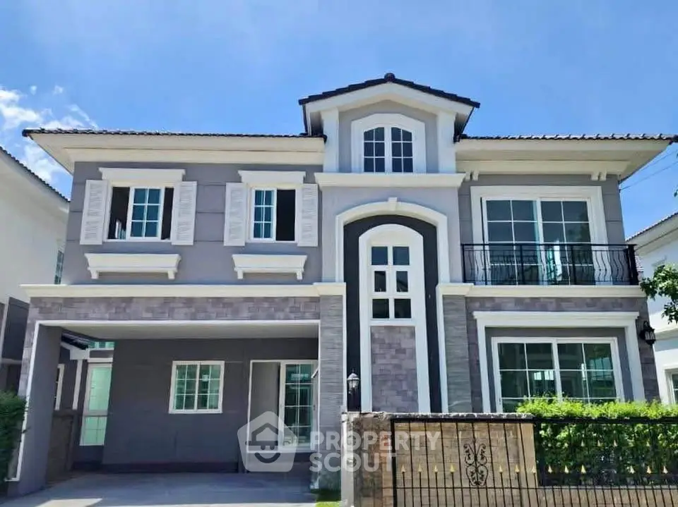 Stunning two-story house with modern design and spacious balcony, perfect for family living.