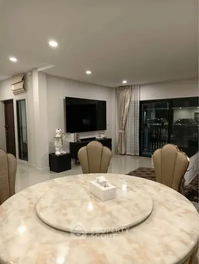 Luxurious living room with elegant dining area and modern decor