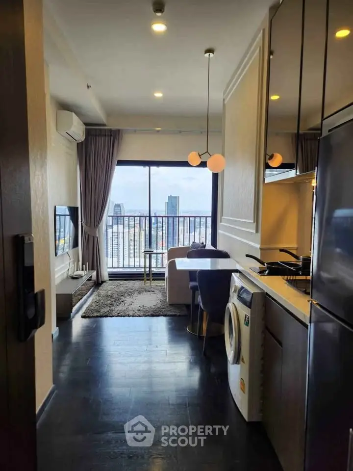 Modern open-layout living room with city view, featuring sleek kitchen and cozy dining area.