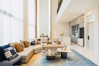 Luxurious modern living room with high ceilings and elegant decor