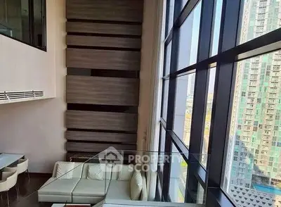 Luxurious high-rise apartment with floor-to-ceiling windows and modern interior design.