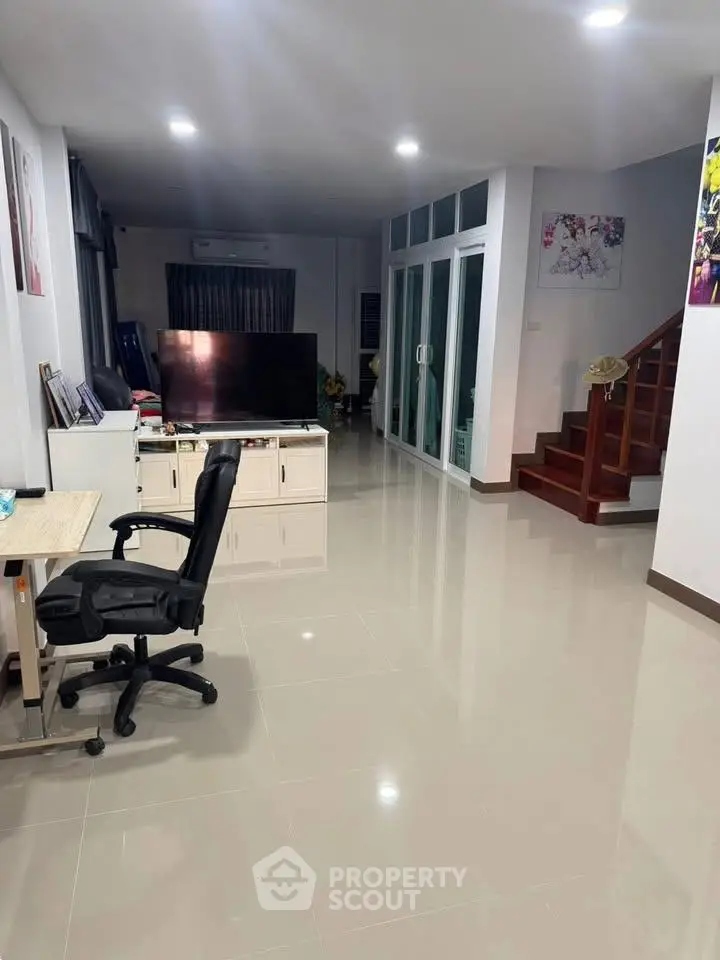 Spacious modern living room with sleek tile flooring and stylish decor