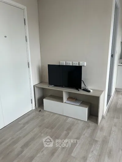 Modern living room with sleek TV stand and minimalist decor