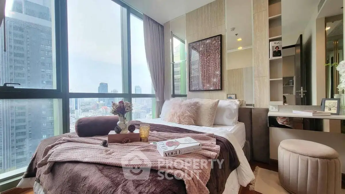 Luxurious bedroom with stunning city view and elegant decor in high-rise apartment