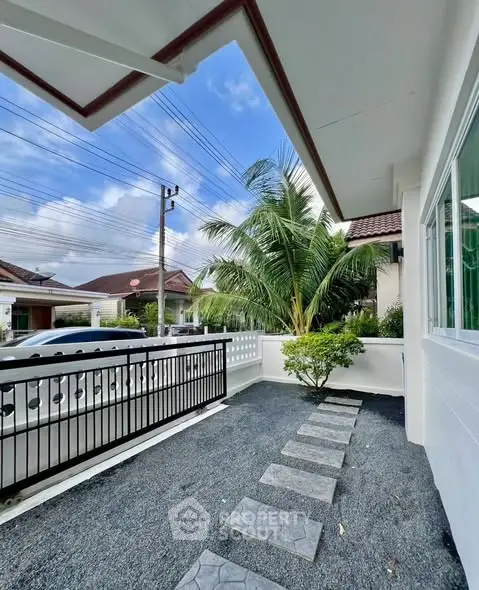 Charming residential exterior with garden and pathway in a serene neighborhood.