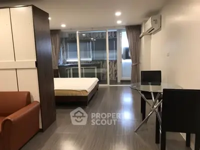 Modern studio apartment with open layout and sleek furnishings