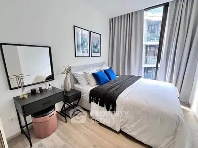 Modern bedroom with stylish decor and large window view