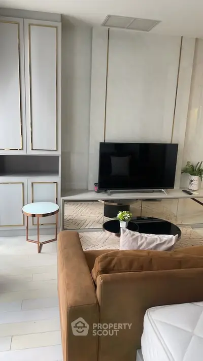Modern living room with sleek TV setup and stylish furniture