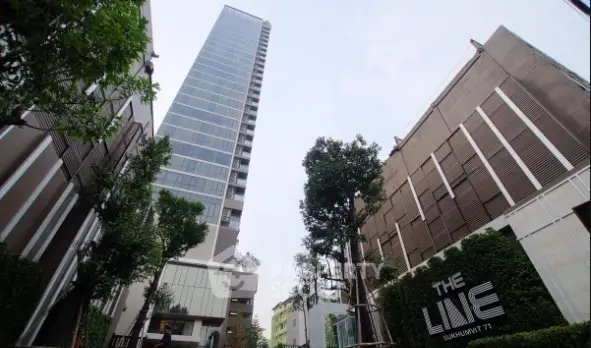 Modern high-rise building with sleek design in urban setting