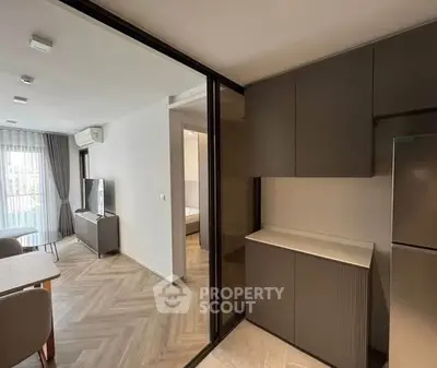 Modern apartment interior with sleek kitchen and cozy living area