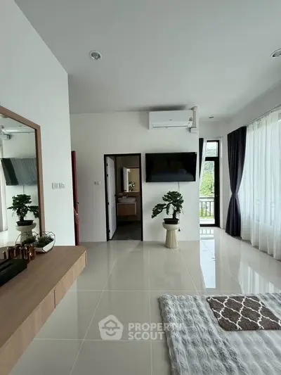Modern living room with sleek design, large windows, and stylish decor in a contemporary home.