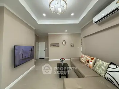 Spacious modern living room with elegant decor and comfortable seating, perfect for relaxation and entertainment.