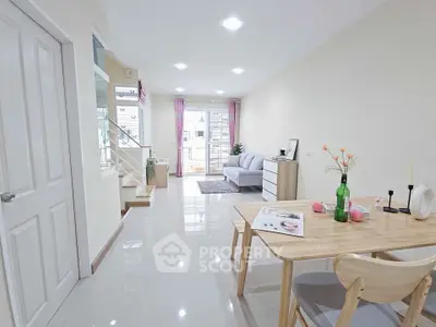 Bright and modern living room with dining area and balcony access