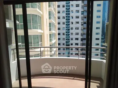 Spacious balcony with city view in modern high-rise building