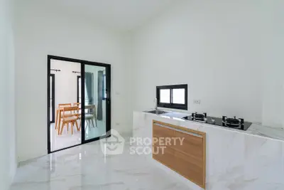 Modern kitchen with sleek marble flooring and open layout design