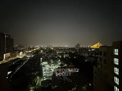 Stunning cityscape night view from high-rise building showcasing vibrant urban lights.