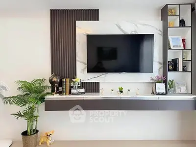 Modern living room with wall-mounted TV and stylish decor