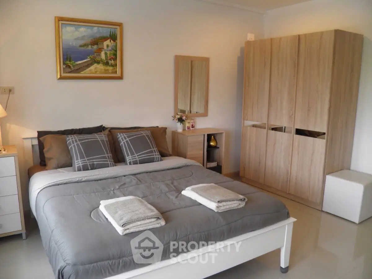 Cozy bedroom with modern decor and stylish wardrobe