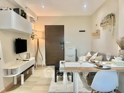 Modern living room with stylish decor and dining area in a cozy apartment.