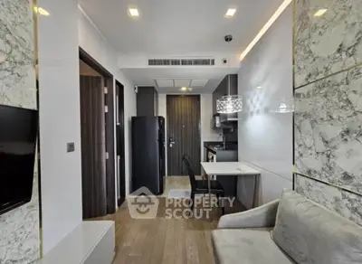 Modern apartment interior with sleek kitchen and cozy living area